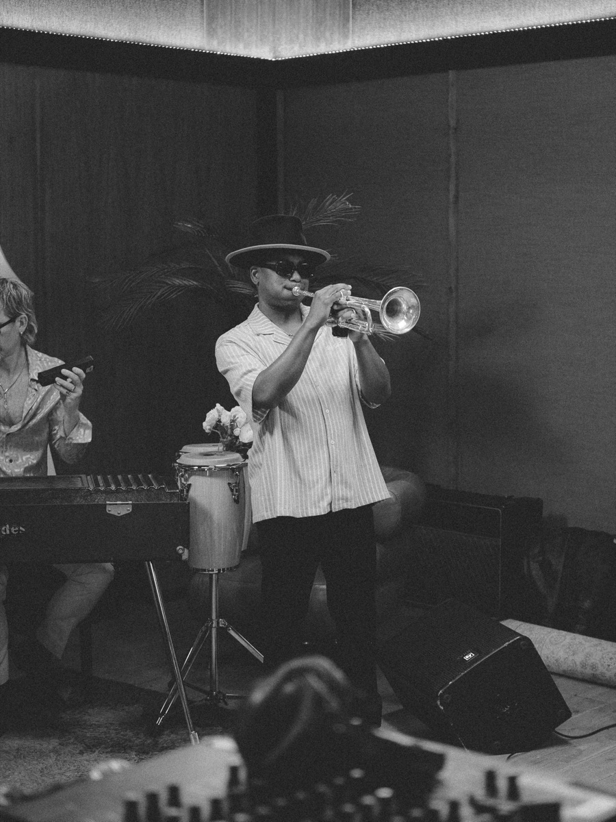 Trumpet player in hat, black and white